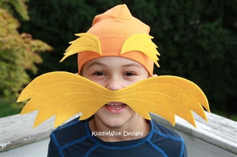 A person wearing a Lorax mustache with different accessories