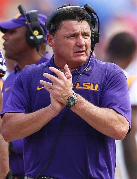 LSU Tigers coach smiling