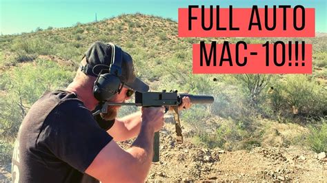 A shooter firing a Mac 10 pistol at a range