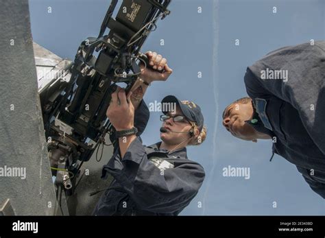 Machine Gunner Maintaining Equipment