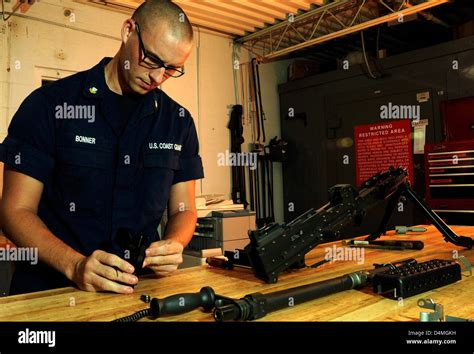 Machine Gunner Performing Maintenance