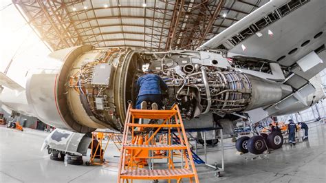 Aeronautical engineers maintaining and repairing aircraft and spacecraft systems