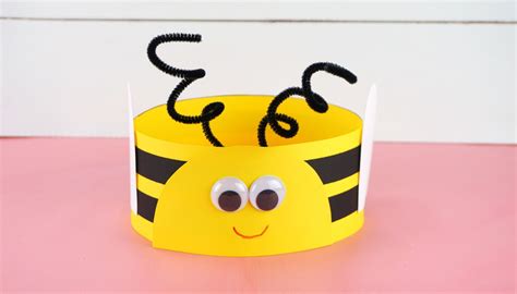 A person making a bee-themed headband