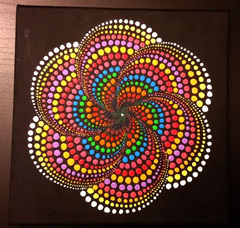 A mandala design featuring dots and intricate patterns