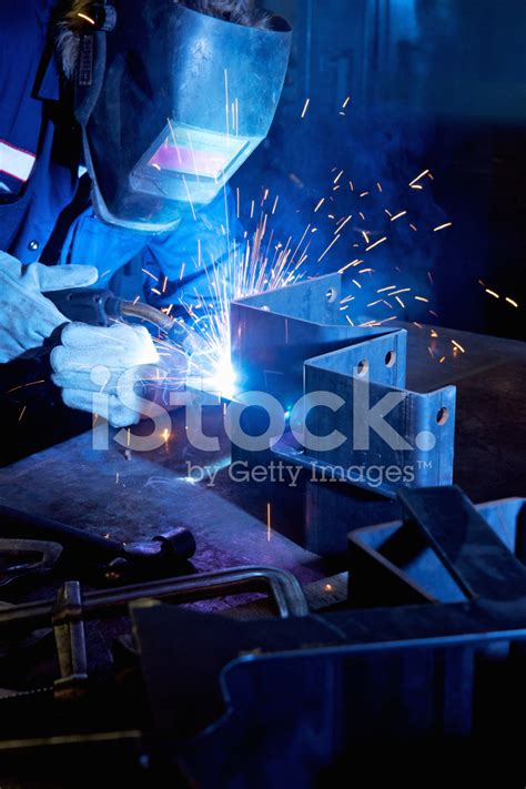 Welder working in a manufacturing plant