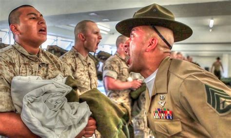 A Marine drill instructor yelling at a recruit