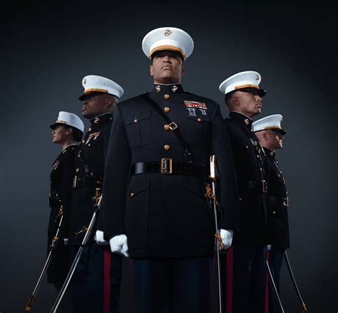 A Marine Corps officer standing in front of an American flag