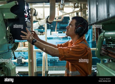 Marine Engineer Inspecting Engine