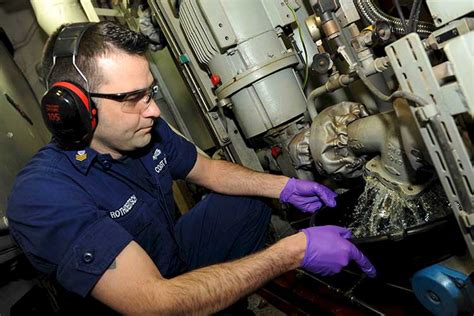 Marine engineer using computer software