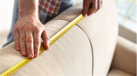 A person measuring furniture using a tape measure