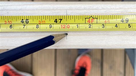 A person using a printable measuring tape for a DIY project