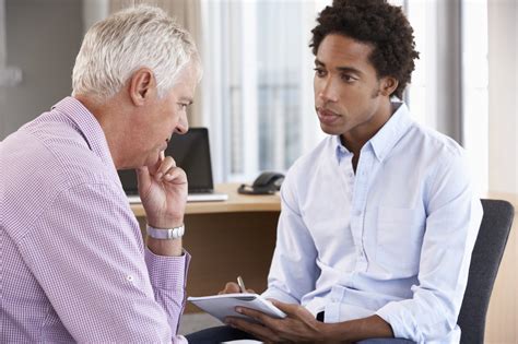 General Practitioner Listening to Patient