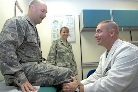 Military doctor examining patient