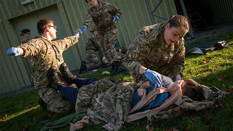 Recruits participating in military first aid training