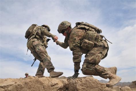 Soldiers laughing and smiling together