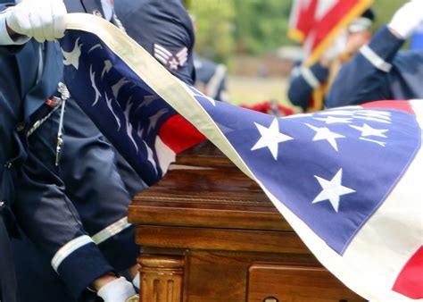 Military funeral songs being played at an active-duty funeral