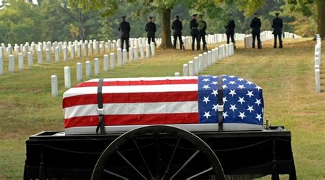 Military funeral songs being played at a reservist's funeral