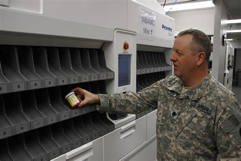 Military pharmacist dispensing medications