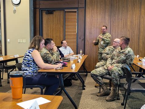 Military personnel speaking to the media