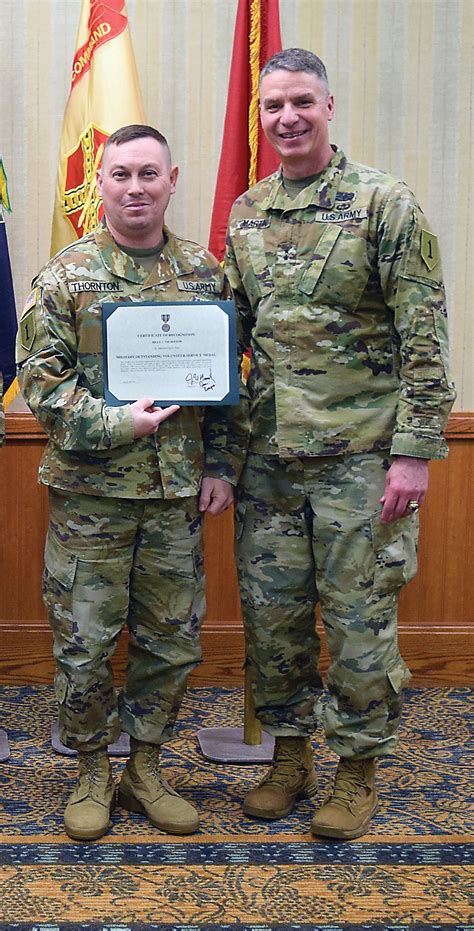 Military personnel receiving an award