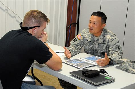 A military recruiter interviewing a potential enlistee