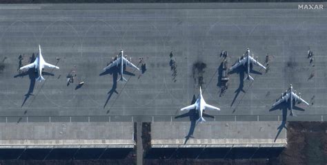 Protesters outside a military base, highlighting the controversies surrounding military bases