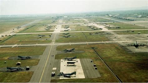 Protesters outside a military base, highlighting the controversies surrounding military bases