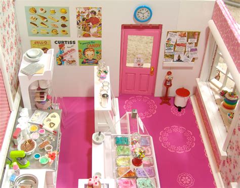 Miniature ice cream parlor setup with Barbie dolls