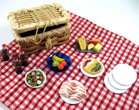 Miniature picnic setup with Barbie dolls