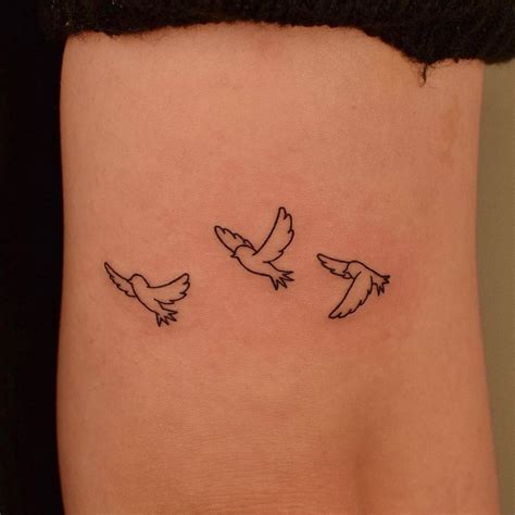 Minimalist Bird Tattoo Design