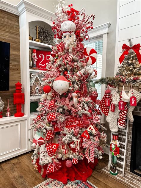 Modern glam red and white Christmas tree decorated with silver ornaments and lights