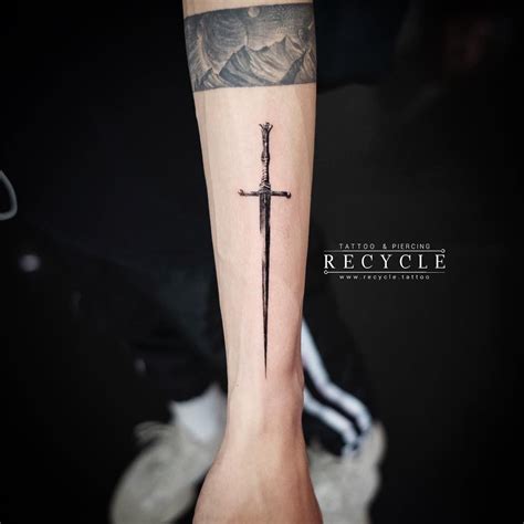 Modern sword tattoo design