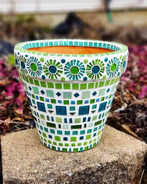 Mosaic flower pot with small tiles and pieces