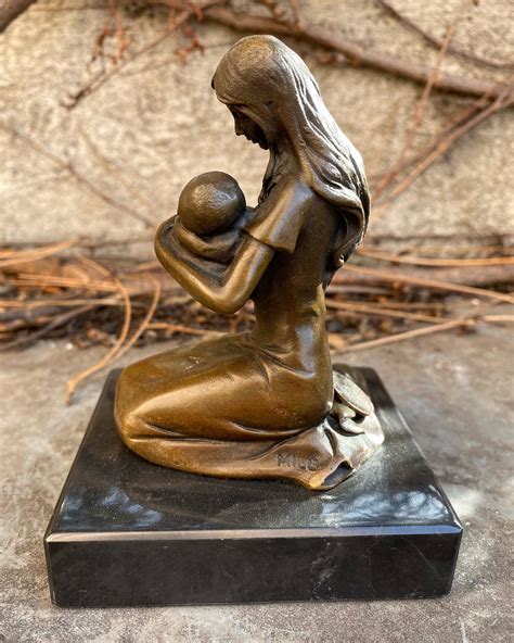 A statue of a mother, symbolizing strength and love