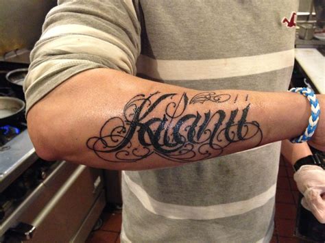 Name tattoos on arm