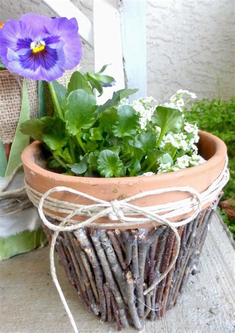 Nature-inspired flower pot with leaves and twigs