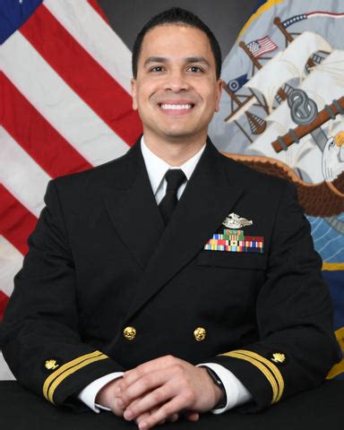 A photo of a naval officer in a professional setting