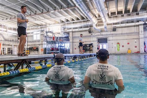 Navy Air Rescue Swimmers using equipment