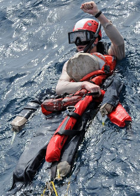 Navy Air Rescue Swimmers participating in a search and rescue mission