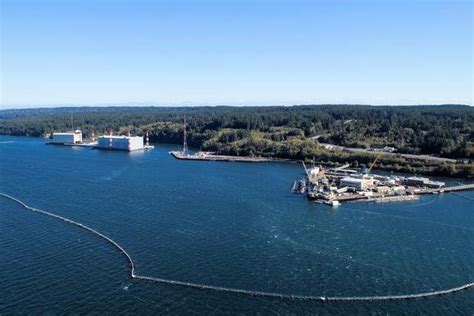 Naval personnel working on a ship at Navy Base Kitsap Bangor