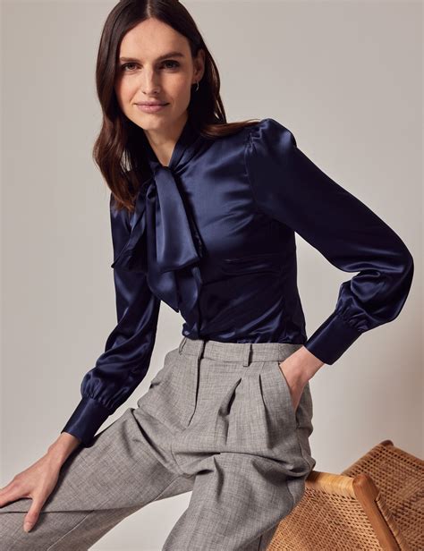 Navy blue blouse with a pair of white pants