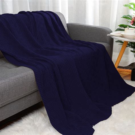 Navy blue sofa with blanket