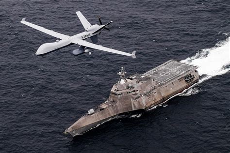 Navy personnel operating a drone