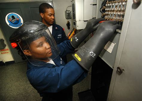 Navy Electrician working on a ship's electrical system