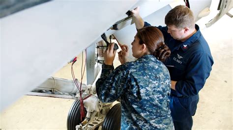 Navy electrician working in an engine room