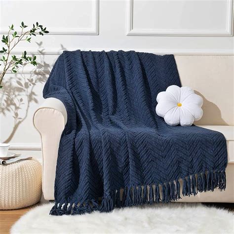 Navy throw blanket in a bedroom