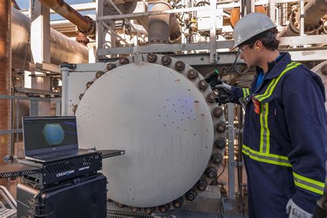 NDT technician inspecting an oil and gas pipeline