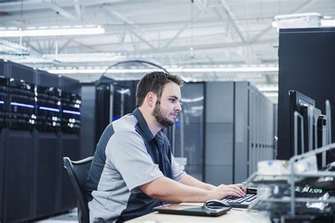 Network administrators working on computer systems