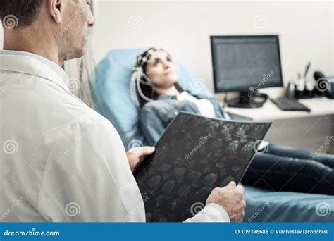 Neurologist with patient