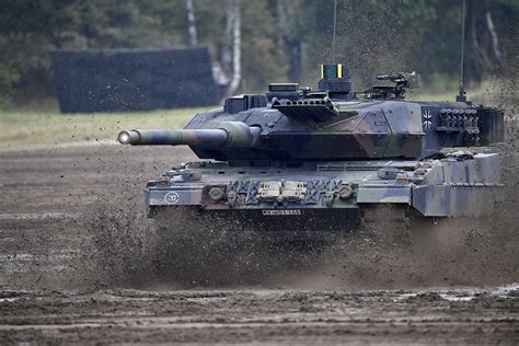 A Canadian soldier inspecting a new tank